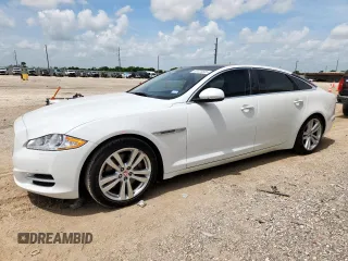 2015 Jaguar XJ Portfolio with VIN SAJWA2GZ7F8V82990, listed as a Copart auction lot 63325535 with 113,892 mi miles and Salvage title. Bid and sale history available at DreamBid. Image 1.