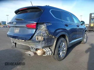 2019 Hyundai Santa Fe SE z VIN 5NMS23AD8KH096209, wystawiony jako IAAI lot #42235035 z przebiegiem 76 543 mil mil oraz . Historia ofert i sprzedaży dostępna na DreamBid. Obrazek 4.