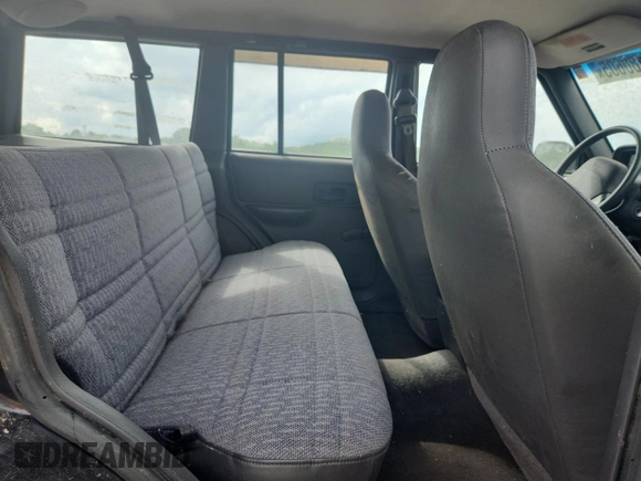 1999 Jeep Cherokee z VIN 1J4FF28P4XL560533, wystawiony jako Copart lot #59180605 z przebiegiem 190 262 mil mil oraz Czysty tytuł • Clean title. Historia ofert i sprzedaży dostępna na DreamBid. Obrazek 10.