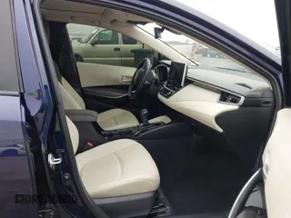 2023 Toyota Corolla Hybrid LE with VIN JTDBCMFE8PJ003081, listed as a IAAI auction lot 41041004 with 19,146 mi miles. Bid and sale history available at carsss.com. Image 5.