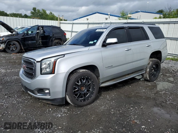 2015 GMC Yukon SLT with VIN 1GKS2BKC9FR518381, listed as a Copart auction lot 66352864 with 103,419 mi miles and Salvage Title. Bid and sale history available at DreamBid. Image 1.
