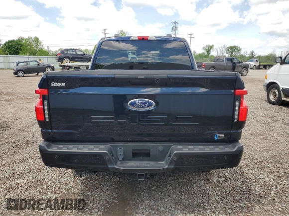 2022 Ford F-150 Lightning Pro z VIN 1FTVW1EL6NWG04931, wystawiony jako Copart lot #59096435 z przebiegiem 26 616 mil mil oraz Szkody całkowita. Historia ofert i sprzedaży dostępna na DreamBid. Obrazek 6.
