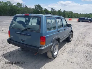 1998 Jeep Cherokee Sport with VIN 1J4FT68S6WL272337, listed as a IAAI auction lot 42147195 with 302,764 mi miles. Bid and sale history available at carsss.com. Image 4.