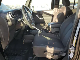 2015 Jeep Wrangler Unlimited Sahara with VIN 1C4BJWEG2FL690498, listed as a Copart auction lot 73598124 with 143,564 mi miles and Salvage Title. Bid and sale history available at carsss.com. Image 7.