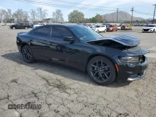 2021 Dodge Charger SXT with VIN 2C3CDXBG9MH682354, listed as a Copart auction lot 48586415 with 112,449 mi miles and Salvage Title. Bid and sale history available at carsss.com. Image 4.
