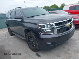 2015 Chevrolet Suburban LT z VIN 1GNSKJKC6FR717403, wystawiony jako IAAI lot #42337087 z przebiegiem 150 555 mil mil oraz . Historia ofert i sprzedaży dostępna na DreamBid. Obrazek 1.