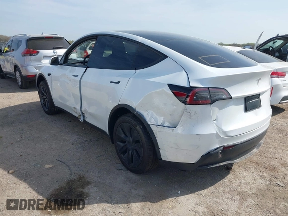 2025 Tesla Model Y Long Range z VIN 7SAYGDED7SA373784, wystawiony jako IAAI lot #41881719 z przebiegiem 1 192 mil mil oraz . Historia ofert i sprzedaży dostępna na DreamBid. Obrazek 3.
