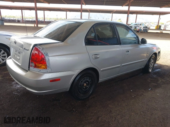2003 Hyundai Accent GL with VIN KMHCG45C93U476176, listed as a IAAI auction lot 41940608 with 212,264 mi miles. Bid and sale history available at carsss.com. Image 4.