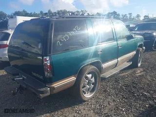 1998 Chevrolet Tahoe with VIN 1GNEK13R1WJ302987, listed as a IAAI auction lot 40491593 with 999,999 mi miles. Bid and sale history available at carsss.com. Image 4.