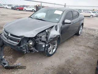 2013 Dodge Avenger SXT with VIN 1C3CDZCB1DN576762, listed as a IAAI auction lot 41938493 with 168,149 mi miles and . Bid and sale history available at carsss.com. Image 2.