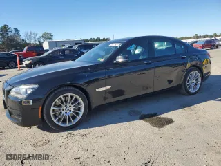 2015 BMW 7 Series 750i xDrive with VIN WBAYB6C57FD965993, listed as a Copart auction lot 83871924 with 76,720 mi miles and Salvage Title. Bid and sale history available at carsss.com. Image 1.