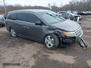 2013 Honda Odyssey Touring with VIN 5FNRL5H95DB050169, listed as a IAAI auction lot 41601958 with 153,086 mi miles. Bid and sale history available at carsss.com. Image 1.