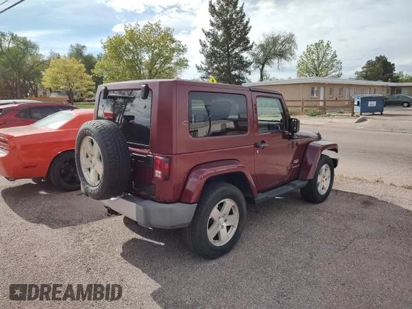 2008 Jeep Wrangler Sahara with VIN 1J4FA54118L537472, listed as a Copart auction lot 57785185 with 121,029 mi miles and Clean title. Bid and sale history available at DreamBid. Image 4.
