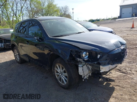 2014 Mazda CX-5 Touring z VIN JM3KE4CY4E0328880, wystawiony jako IAAI lot #42112302 z przebiegiem 185 228 mil mil oraz . Historia ofert i sprzedaży dostępna na DreamBid. Obrazek 1.