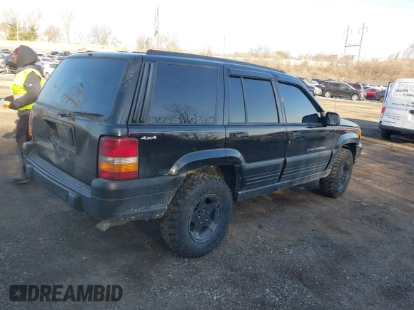 1996 Jeep Grand Cherokee Laredo with VIN 1J4GZ58S3TC197587, listed as a IAAI auction lot 41423318 with 200,116 mi miles. Bid and sale history available at carsss.com. Image 4.