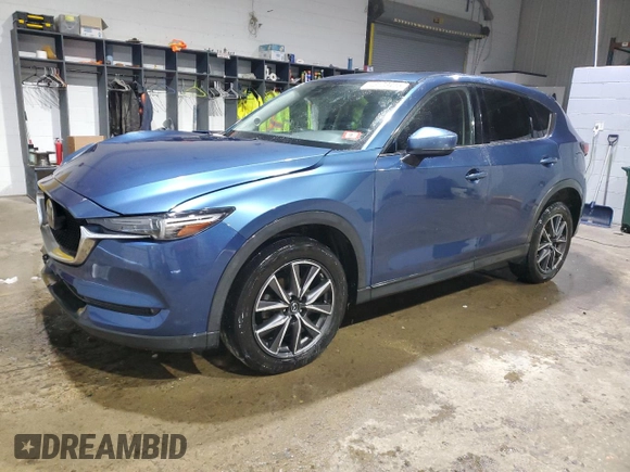 2018 Mazda CX-5 Grand Touring with VIN JM3KFBDM1J0304706, listed as a Copart auction lot 46123415 with 104,004 mi miles and Salvage title. Bid and sale history available at DreamBid. Image 1.