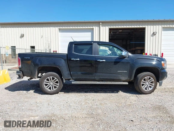 2015 GMC Canyon 2WD SLT with VIN 1GTG5CE35F1249224, listed as a IAAI auction lot 41697796 with 180,230 mi miles. Bid and sale history available at carsss.com. Image 13.