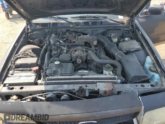 2007 Ford Police Interceptor z VIN 2FAFP71WX7X156954, wystawiony jako Copart lot #60929015 z przebiegiem 174 531 mil mil oraz Szkoda całkowita • Salvage title. Historia ofert i sprzedaży dostępna na DreamBid. Obrazek 11.