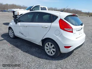 2011 Ford Fiesta SE with VIN 3FADP4EJ3BM231633, listed as a IAAI auction lot 41915946 with 130,891 mi miles. Bid and sale history available at carsss.com. Image 3.