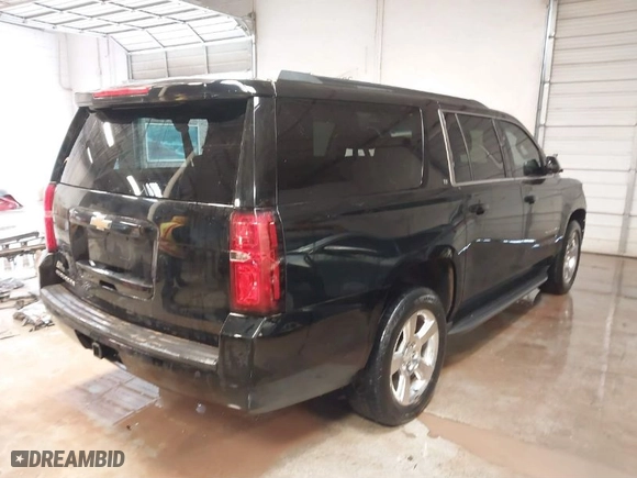 2016 Chevrolet Suburban LT with VIN 1GNSKHKC1GR109217, listed as a IAAI auction lot 41541377 with 213,195 mi miles. Bid and sale history available at carsss.com. Image 4.