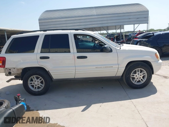 2003 Jeep Grand Cherokee Laredo with VIN 1J4GX48S43C518584, listed as a IAAI auction lot 42213094 with 163,743 mi miles and . Bid and sale history available at DreamBid. Image 14.
