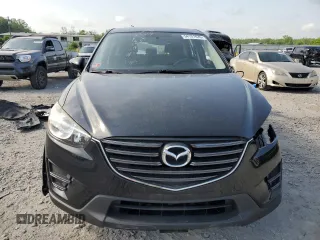 2016 Mazda CX-5 Sport with VIN JM3KE4BY6G0749973, listed as a Copart auction lot 54131635 with 97,480 mi miles and Salvage title. Bid and sale history available at DreamBid. Image 5.