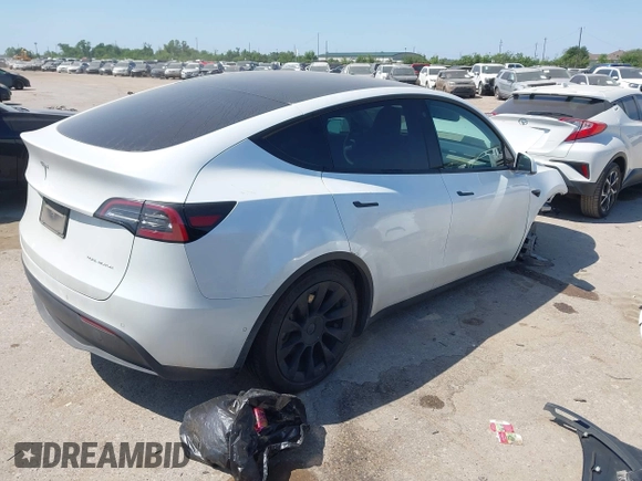 2021 Tesla Model Y Long Range with VIN 5YJYGDEE0MF265339, listed as a IAAI auction lot 41975058 with 51,292 mi miles and . Bid and sale history available at DreamBid. Image 4.