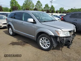 2017 Dodge Journey SXT with VIN 3C4PDDBG4HT608395, listed as a Copart auction lot 60811885 with 145,503 mi miles and Salvage title. Bid and sale history available at DreamBid. Image 4.