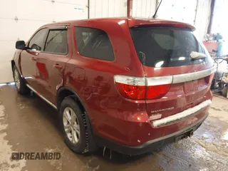 2013 Dodge Durango SXT with VIN 1C4RDJAG4DC527945, listed as a IAAI auction lot 41590545 with 141,074 mi miles and . Bid and sale history available at DreamBid. Image 3.