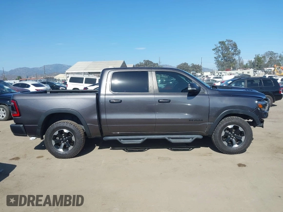 2022 Ram 1500 Rebel z VIN 1C6SRFLT4NN177112, wystawiony jako IAAI lot #42402050 z przebiegiem 26 239 mil mil oraz . Historia ofert i sprzedaży dostępna na DreamBid. Obrazek 13.