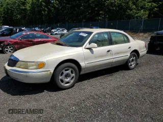 2000 Lincoln Continental z VIN 1LNHM97V9YY807381, wystawiony jako Copart lot #60002835 z przebiegiem 96 519 mil mil oraz Czysty tytuł • Clean title. Historia ofert i sprzedaży dostępna na DreamBid. Obrazek 1.