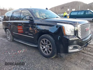 2016 GMC Yukon Denali with VIN 1GKS2CKJ2GR412201, listed as a IAAI auction lot 41185716 with 124,421 mi miles. Bid and sale history available at carsss.com. Image 1.