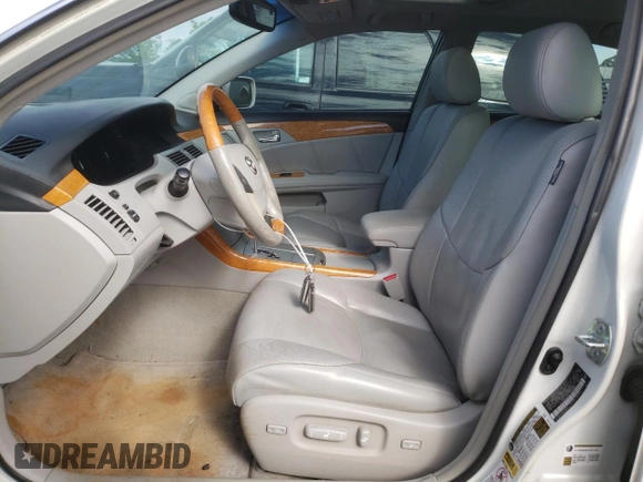 2007 Toyota Avalon XL z VIN 4T1BK36B67U251181, wystawiony jako Copart lot #58021485 z przebiegiem 166 367 mil mil oraz Szkoda całkowita • Salvage title. Historia ofert i sprzedaży dostępna na DreamBid. Obrazek 7.