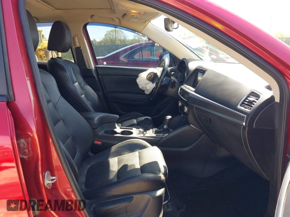 2016 Mazda CX-5 Grand Touring with VIN JM3KE2DYXG0652017, listed as a IAAI auction lot 42041158 with 95,946 mi miles and . Bid and sale history available at DreamBid. Image 5.