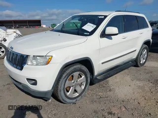 2011 Jeep Grand Cherokee Laredo with VIN 1J4RS4GGXBC517068, listed as a IAAI auction lot 42173780 with 170,688 mi miles and . Bid and sale history available at DreamBid. Image 2.