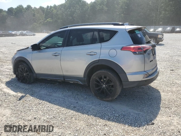 2018 Toyota RAV4 XLE with VIN 2T3WFREVXJW427748, listed as a Copart auction lot 61833055 with 104,057 mi miles and Salvage title. Bid and sale history available at DreamBid. Image 2.