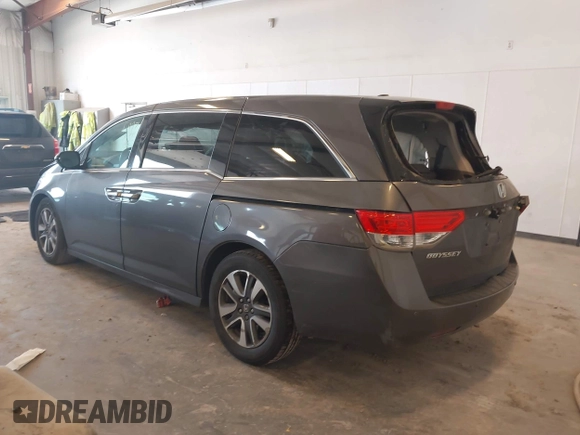 2014 Honda Odyssey Touring with VIN 5FNRL5H99EB105059, listed as a IAAI auction lot 42457672 with 240,581 mi miles and . Bid and sale history available at DreamBid. Image 3.