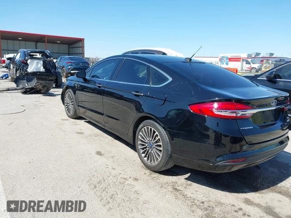 2017 Ford Fusion SE z VIN 3FA6P0HD1HR138693, wystawiony jako IAAI lot #41837634 z przebiegiem 117 638 mil mil oraz . Historia ofert i sprzedaży dostępna na DreamBid. Obrazek 3.