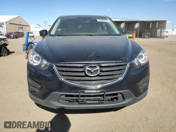 2016 Mazda CX-5 Sport with VIN JM3KE4BY4G0734582, listed as a Copart auction lot 55908515 with 52,323 mi miles and Salvage title. Bid and sale history available at DreamBid. Image 5.