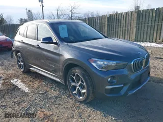 2018 BMW X1 xDrive28i with VIN WBXHT3C33J5F90349, listed as a IAAI auction lot 41385063 with 55,994 mi miles. Bid and sale history available at carsss.com. Image 1.
