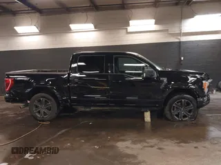 2023 Ford F-150 XL with VIN 1FTFW1E5XPKE80999, listed as a IAAI auction lot 41596993 with 33,285 mi miles. Bid and sale history available at carsss.com. Image 14.