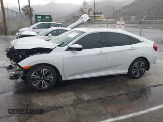 2020 Honda Civic EX-L with VIN 19XFC1F7XLE208720, listed as a IAAI auction lot 41725235 with 70,794 mi miles and . Bid and sale history available at DreamBid. Image 14.