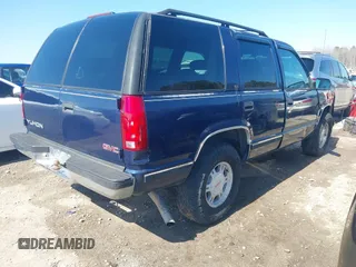 1999 GMC Yukon with VIN 1GKEK13R2XJ708582, listed as a IAAI auction lot 41698586 with 252,630 mi miles. Bid and sale history available at carsss.com. Image 4.