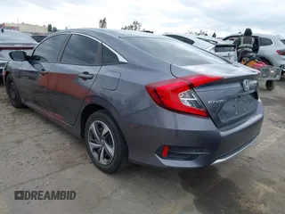 2020 Honda Civic LX with VIN 2HGFC2F64LH576765, listed as a IAAI auction lot 41881444 with 32,129 mi miles and . Bid and sale history available at DreamBid. Image 3.
