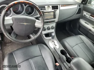 2010 Chrysler Sebring Limited with VIN 1C3BC6EV5AN144868, listed as a Copart auction lot 66549774 with 106,602 mi miles and Salvage Title. Bid and sale history available at carsss.com. Image 8.