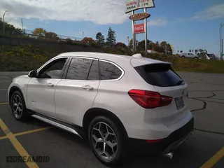 2016 BMW X1 xDrive28i with VIN WBXHT3C3XGP880243, listed as a Copart auction lot 54556895 with 57,200 mi miles and Clean Title. Bid and sale history available at carsss.com. Image 3.