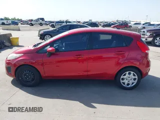 2012 Ford Fiesta SE z VIN 3FADP4EJ9CM140948, wystawiony jako IAAI lot #42301818 z przebiegiem 109 276 mil mil oraz . Historia ofert i sprzedaży dostępna na DreamBid. Obrazek 15.