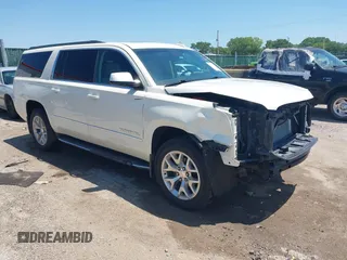 2015 GMC Yukon XL SLT z VIN 1GKS2HKC1FR621863, wystawiony jako IAAI lot #42672636 z przebiegiem 206 050 mil mil oraz . Historia ofert i sprzedaży dostępna na DreamBid. Obrazek 1.