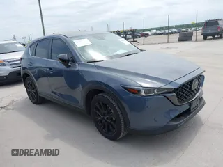2024 Mazda CX-5 S Carbon Edition z VIN JM3KFBCL9R0475899, wystawiony jako IAAI lot #42040305 z przebiegiem 4772 mil mil oraz . Historia ofert i sprzedaży dostępna na DreamBid. Obrazek 1.