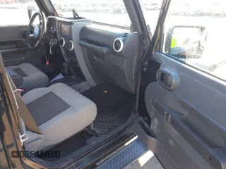 2010 Jeep Wrangler Unlimited Sahara with VIN 1J4HA5H16AL215659, listed as a IAAI auction lot 41749218 with 55,544 mi miles. Bid and sale history available at carsss.com. Image 5.